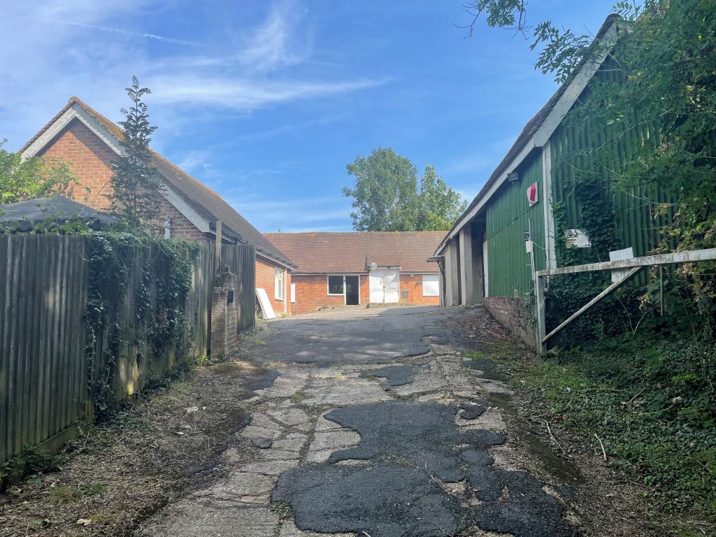 Lot: 8 - FREEHOLD COMMERCIAL OPPORTUNITY WITH POTENTIAL IN FAVOURED SOUTH DOWNS LOCATION - View of site from private drive